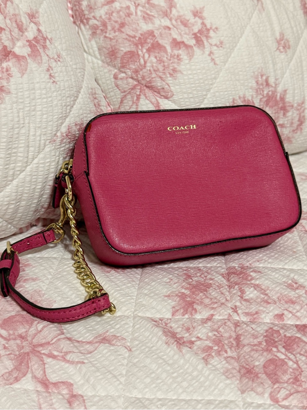 Coach Flight Wristlet Wallet in pink Saffiano leather.